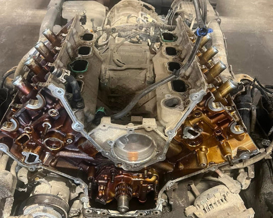 Car engine in a workshop setting